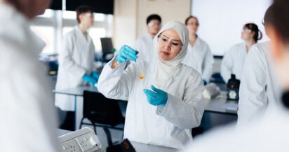 students with test tube studying applied science at hull college