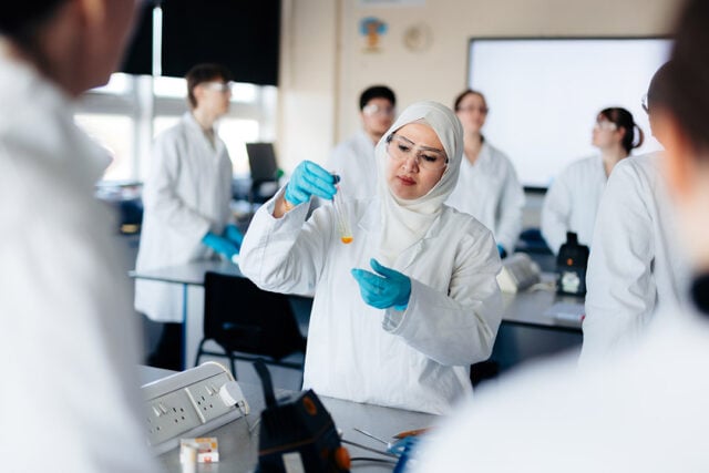students with test tube studying applied science at hull college