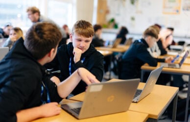 Two male 14+ students in class