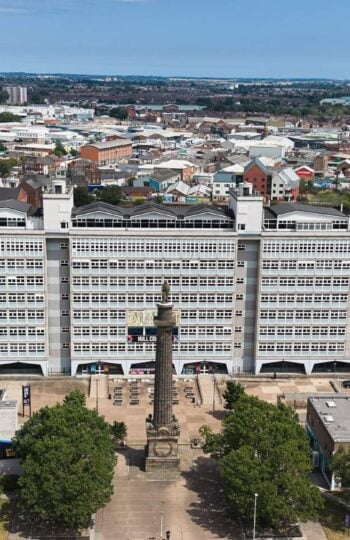 drone shot of the hull college campus with tower block and wilberforce statue
