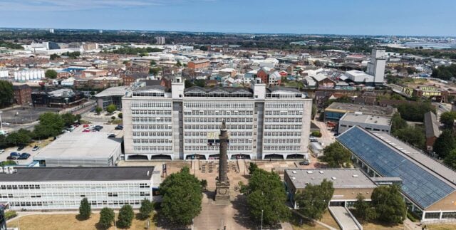 drone shot of the hull college campus with tower block and wilberforce statue