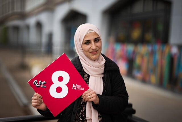 Adult learner with her GCSE results