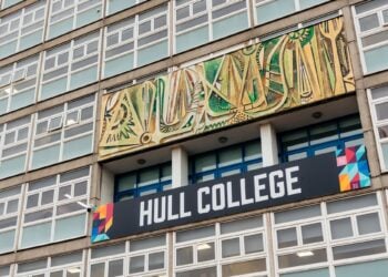 Exterior of a building showing a modern mural with abstract patterns above the entrance. A sign with "Hull College" stands out prominently.
