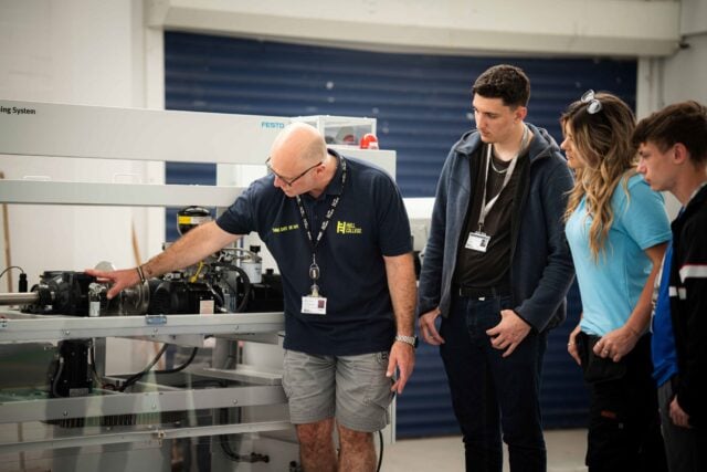 Nick Marshall, Head of Engineering and Advanced Motor Vehicle at Hull College, showing students some of the specialist equipment in greenwave
